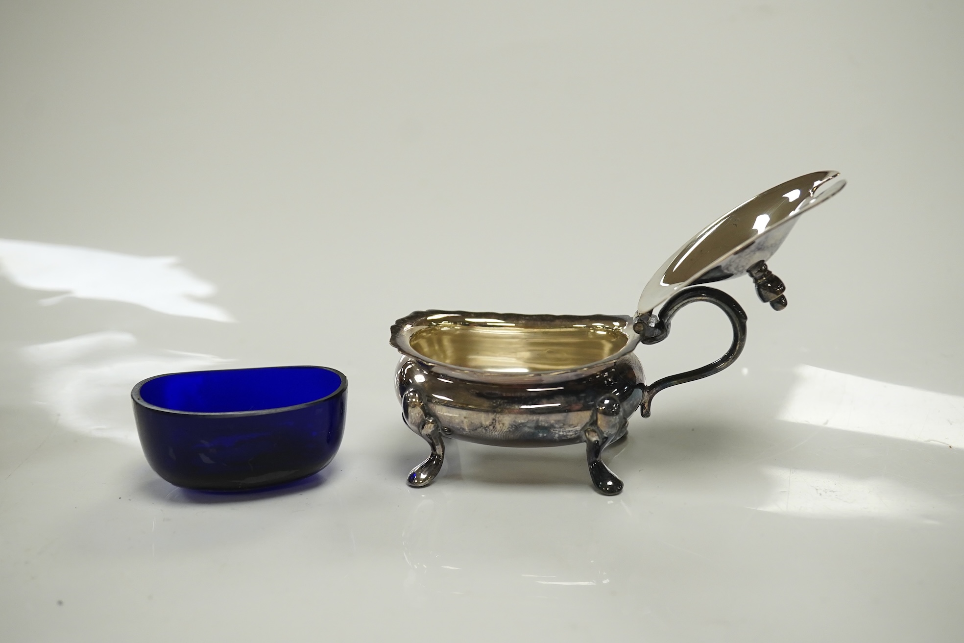 A cased 1960's three piece silver condiment set by William Suckling Ltd and and a cased pair of George III silver berry spoons, George Smith IV, London, 1812. Condition - fair